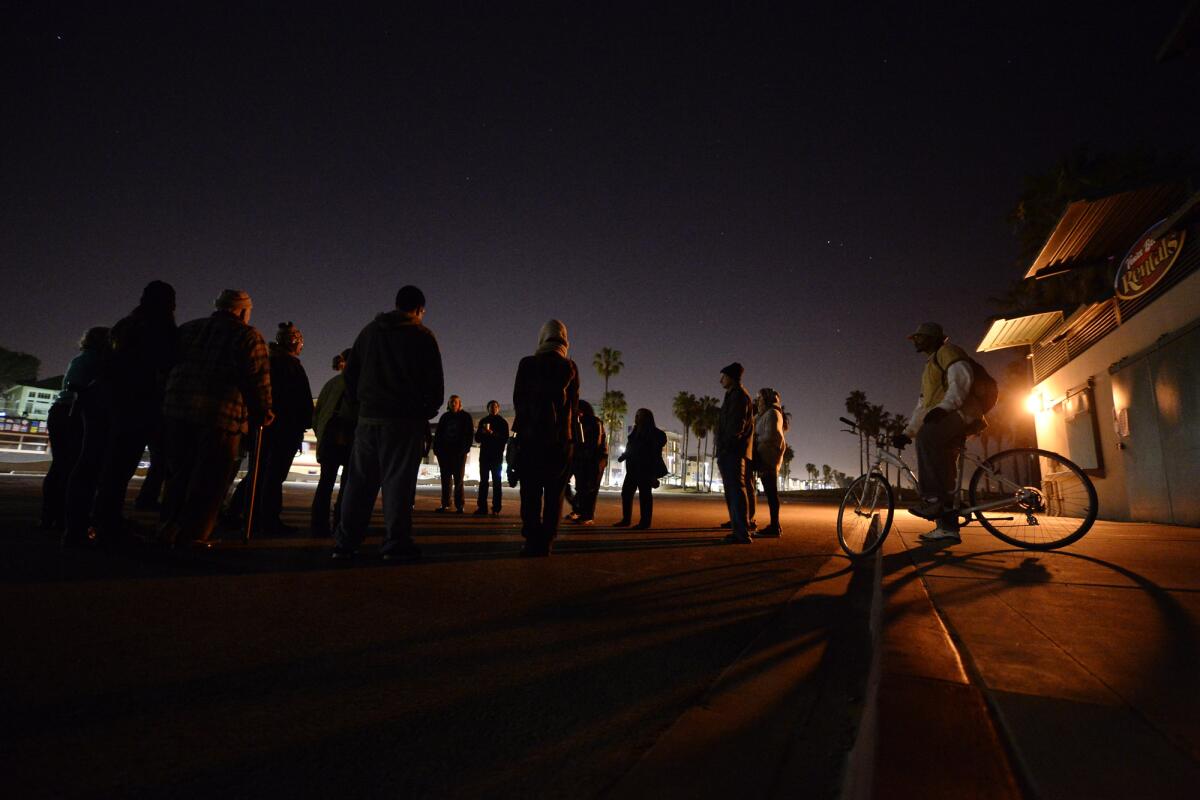 Protesters gathers in April at Venice Beach to challenge the midnight-to-5 a.m. curfew. Venice activists have sued the city seeking to overturn the ban.
