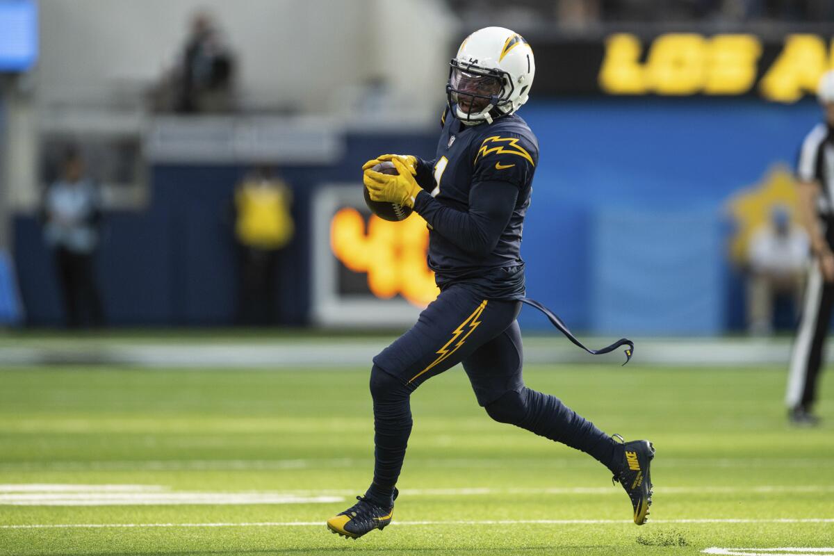 Chargers wide receiver DeAndre Carter runs with the ball against the Seahawks on Oct. 23.