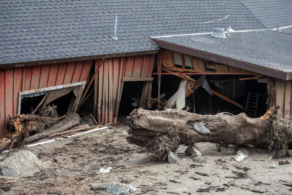 A house sustained heavy damage from mud and debris in Oak Glen, Calif.