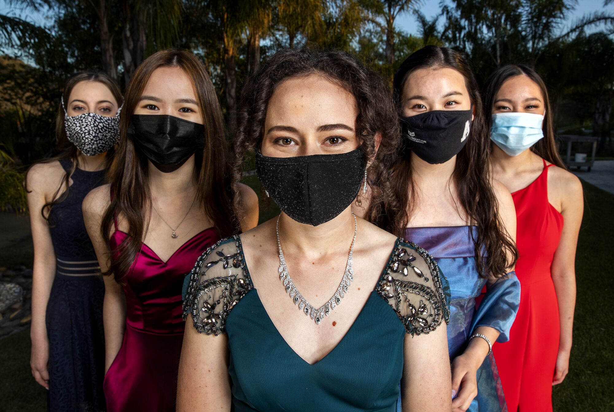 Five students in formal wear and masks.