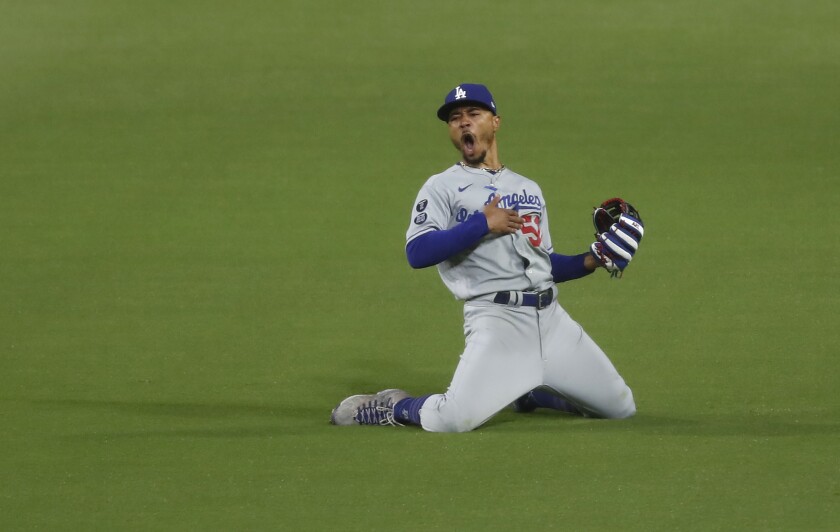 Los Angeles Dodgers' Mookie Betts celebrates after making a diving catch 