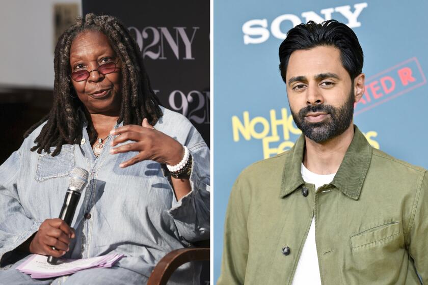 Whoopi Goldberg holds a mic while  seated and gestures with one hand; Hasan Minhaj poses in a tan shirt over a white tee