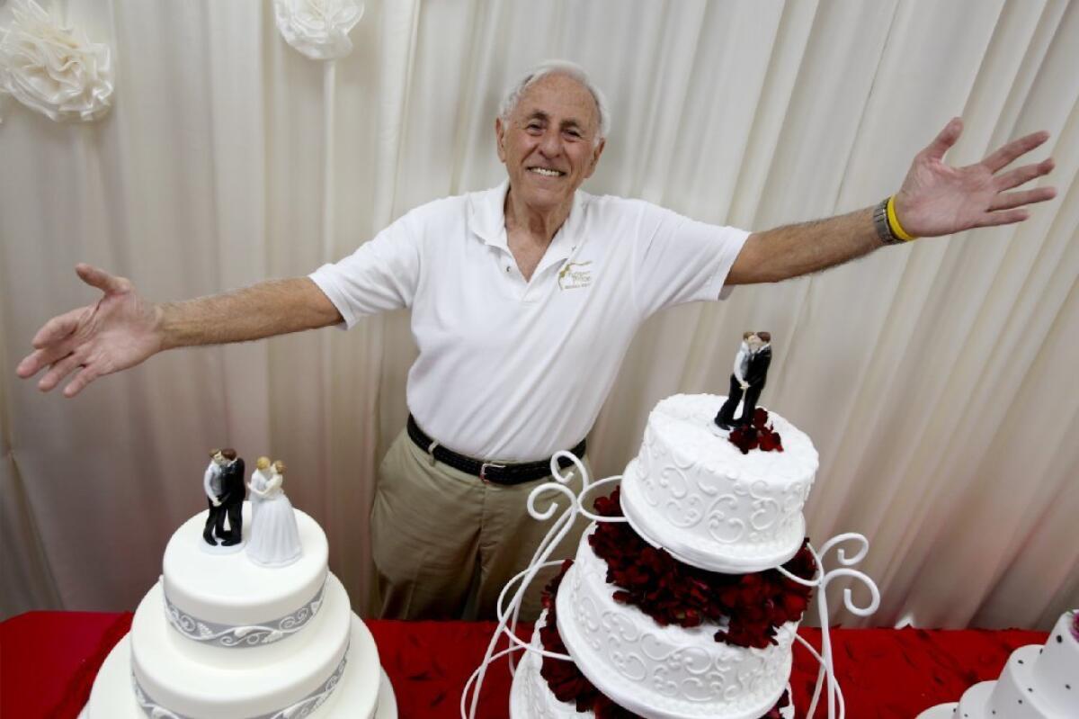 Charlie Feder of Rossmoor Pastries poses with wedding cakes for gay and lesbian couples in Signal Hill in 2013.