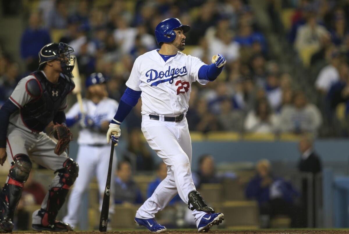 Adrian Gonzalez hits a two-run home run in the fifth inning of the Dodgers' 8-0 victory over the Atlanta Braves on May 26 at Dodger Stadium.