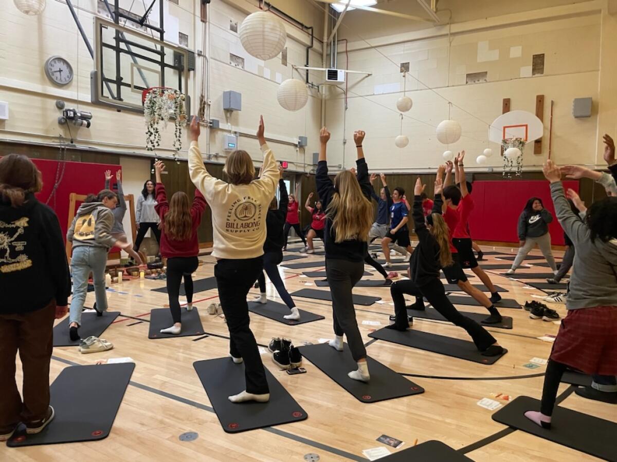 Students participate in yoga-like exercises as part of a breathwork session at La Jolla High School last school year.