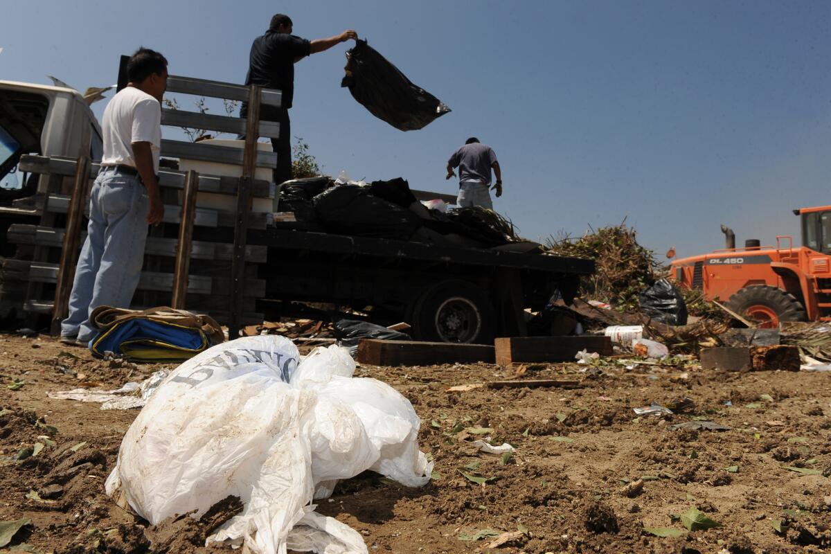 Work crews dump trash at the Scholl Canyon landfill in Los Angeles last June.