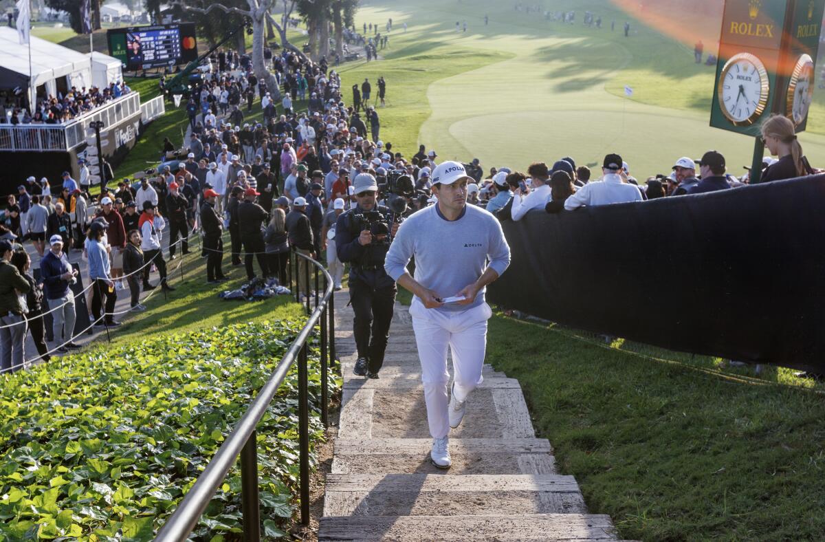 Patrick Cantlay climbs the staircase above the 18th green at Riviera.
