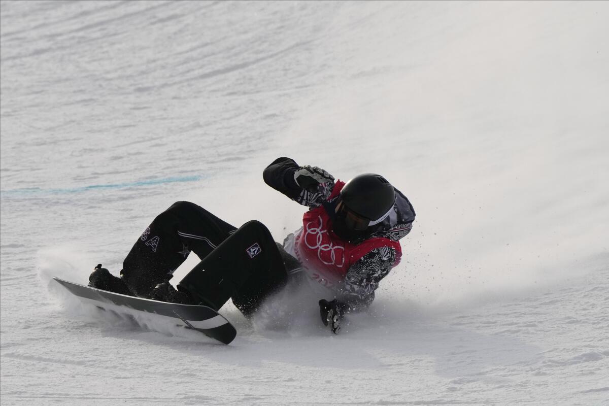 Shaun White of the United States reacts after his first run in the