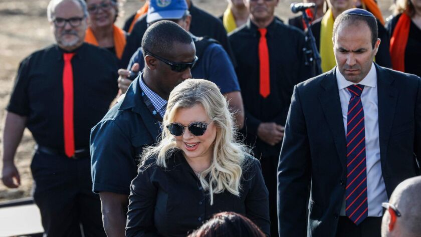 Sara Netanyahu, center, wife of the Israeli prime minister, attends the unveiling ceremony for the new settlement of Ramat Trump, or Trump Heights, named after the U.S. president, in the Israeli-annexed Golan Heights on Sunday.