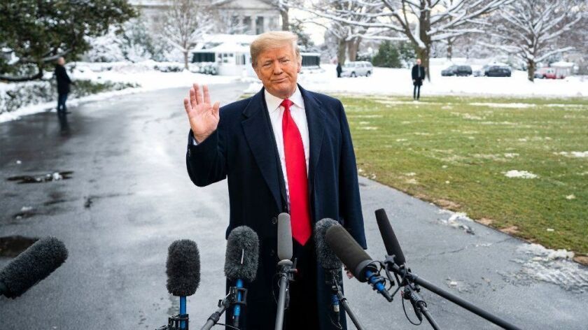 President Trump speaks to the media outside the White House on Jan. 14.