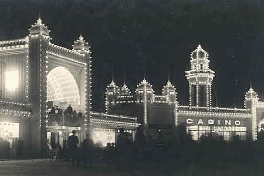 Wonderland's bandstand and Casino are aglow after dark.
