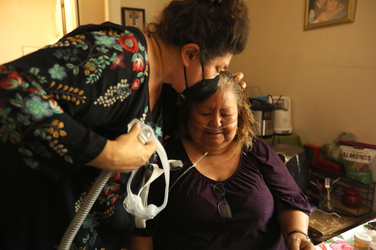 Dr. Heidi Behforouz, left, comforts patient Micaela Duarte.
