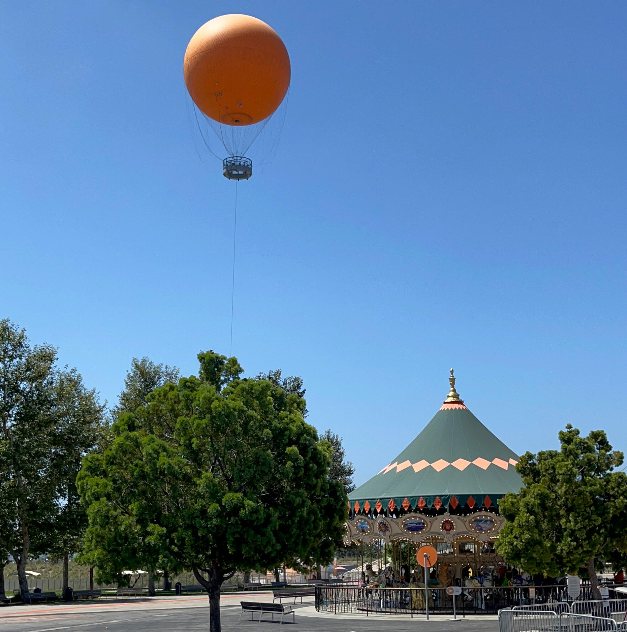 A giant balloon floats in the sky.