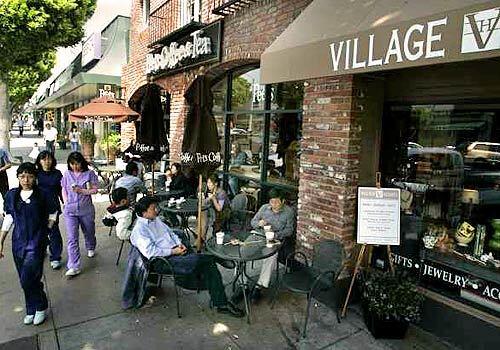 STREET SCENE: Shops and restaurants draw pedestrians to prosperous Larchmont Village.