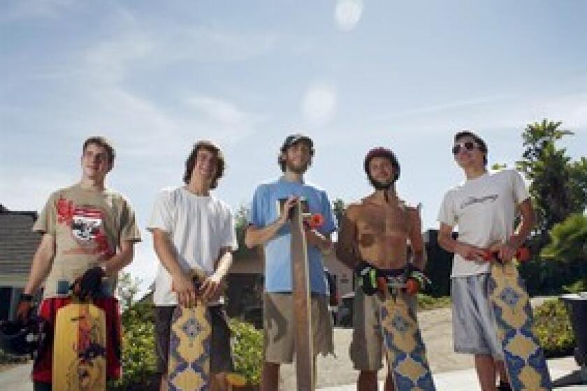 Longboarders are shown at the popular Franklin Street hill in Santa Monica. From left, Kevin Reimer, 19, of Vancouver, Canada; James Kelly, 18, of Petaluma, Calif.; Adam Stokowski, 23, of Springfield, Va.; Adam Colton, 25, of Santa Monica; and Louis Pilloni, 22, of Thousand Oaks.