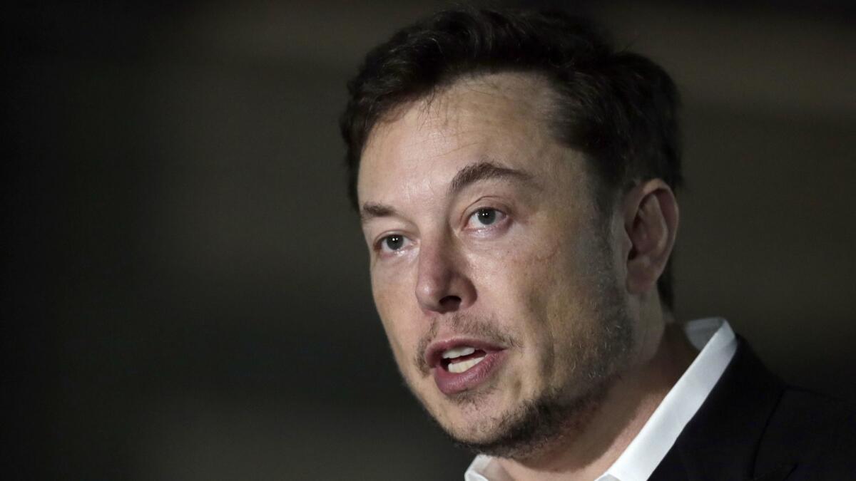 Tesla CEO and founder of the Boring Co., Elon Musk, speaks at a news conference in Chicago on June 14, 2018. Musk announced Tuesday, Aug. 7, that he is considering taking the electric car maker private.