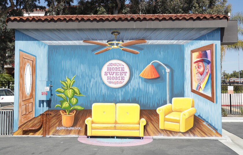 "Home Sweet Home," painted on a storage facility on 19th St. by artist Zaoone, is one of many colorful murals in Costa Mesa.