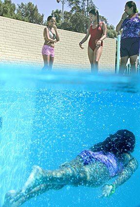 East Los Angeles residents refresh themselves at the City Terrace Park swimming pool.