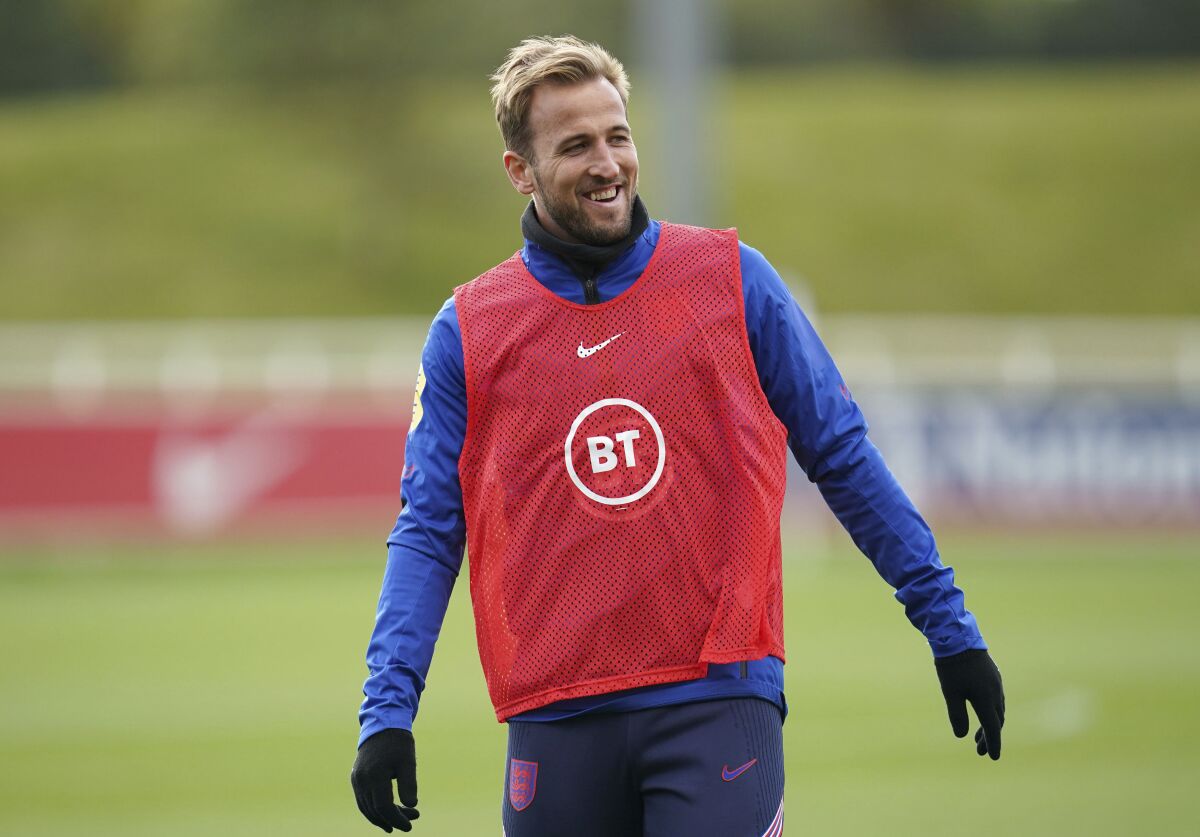 England's Harry Kane smiles during a training session at St George's Park, Burton upon Trent, England, Tuesday, Oct. 5, 2021 ahead of the upcoming World Cup 2022, group I qualifying soccer matches against Andorra and Hungary. (Nick Potts/PA via AP)