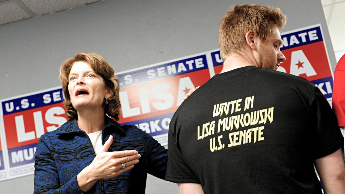 Alaska Sen. Lisa Murkowski with a supporter at a rally in Juneau in 2010, when she had to mount a write-in campaign to keep her seat.