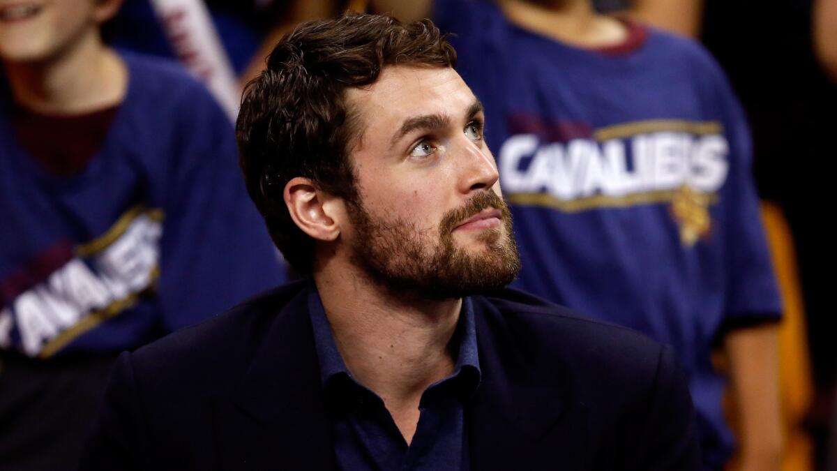 Kevin Love sits on the bench during Game 4 of the Eastern Conference finals between the Cleveland Cavaliers and Atlanta Hawks on May 26.