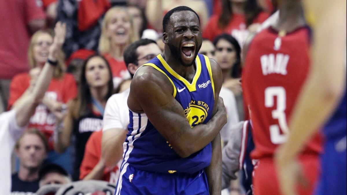 Golden State Warriors forward Draymond Green reacts during the team's 118-113 playoff series-clinching victory over the Houston Rockets on May 10.