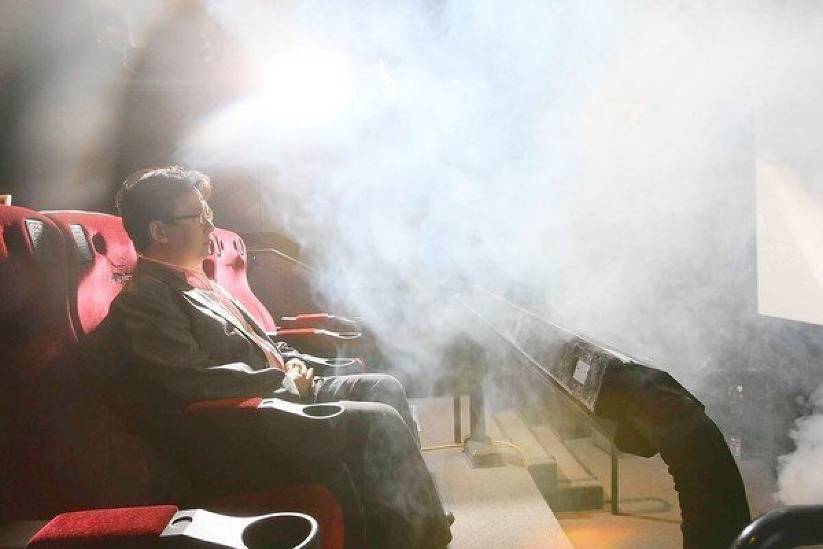 Theodore Kim -- chief operating officer of the Los Angeles lab of theater operator CJ 4DPlex -- is hit with fog, one of the special effects the company creates for its "4-D" moviegoing experience.