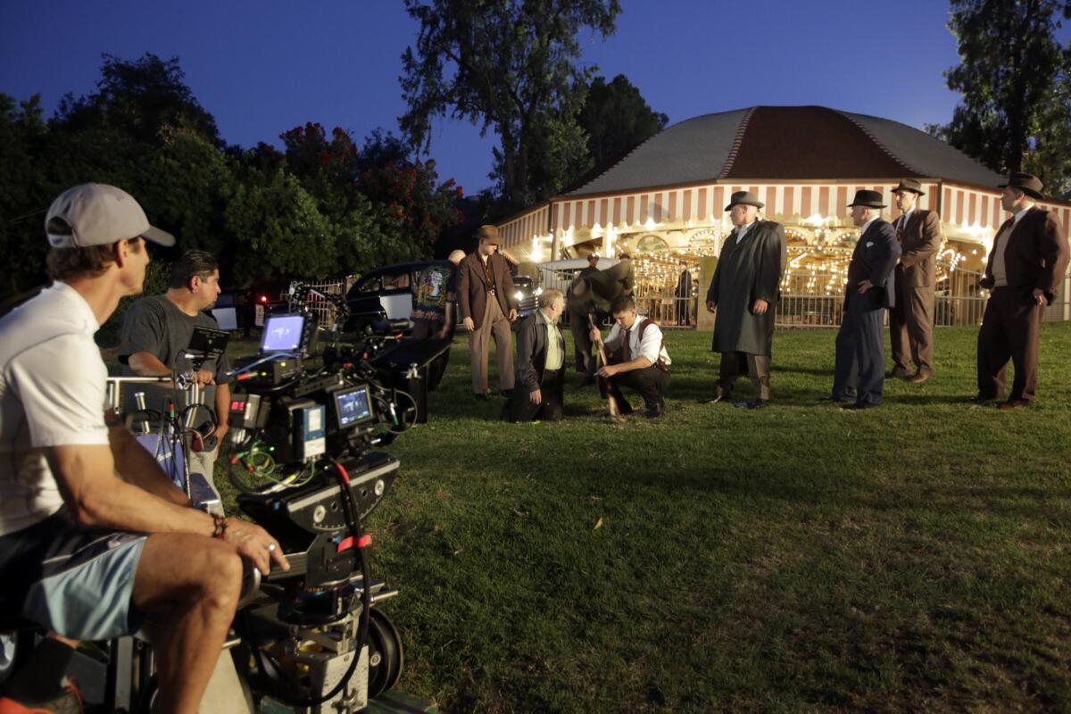 The "Mob City" cast and crew film a scene of the 1940s-set crime drama in Griffith Park on July 8, 2013. The TNT show from writer/producer Frank Darabont was earlier titled "Lost Angels."