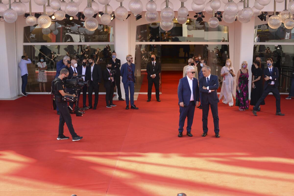 Spanish director Pedro Almodovar and Venice Film Festival chief Alberto Barbera on the red carpet.