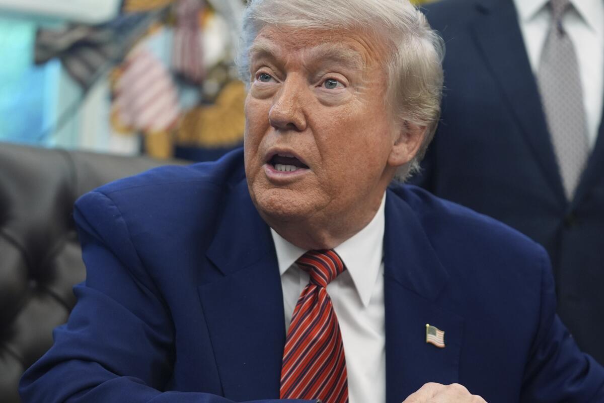 President Donald Trump speaks to reporters