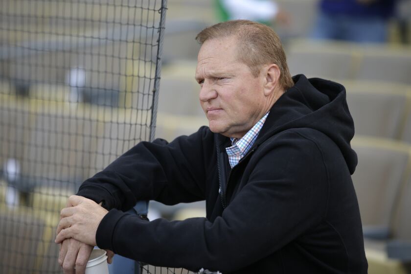 Sports agent Scott Boras watches the Miami Marlins players practice before a baseball game against the Los Angeles Dodgers, Monday, May 11, 2015, in Los Angeles. (AP Photo/Jae C. Hong) ORG XMIT: NYOTK ** Usable by LA and DC Only **