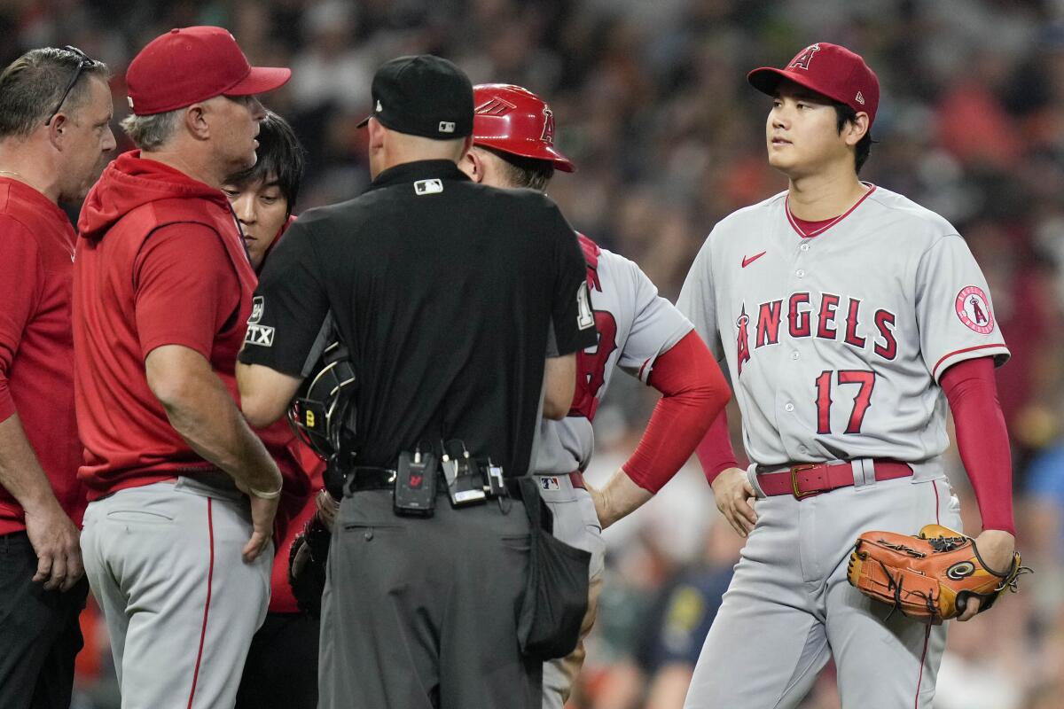 Angels pitcher Shohei Ohtani is removed from the game in the sixth inning because of a blister on his right index finger.