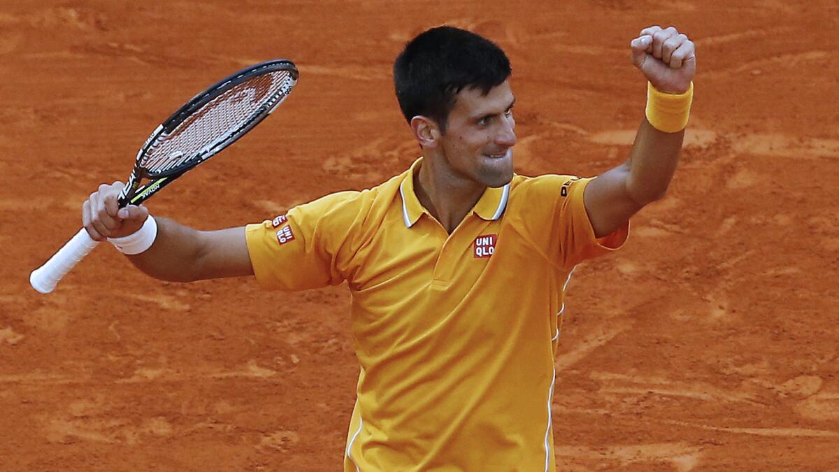 Novak Djokovic celebrates during his victory over Tomas Berdych in the Monte Carlo Masters final on Sunday.