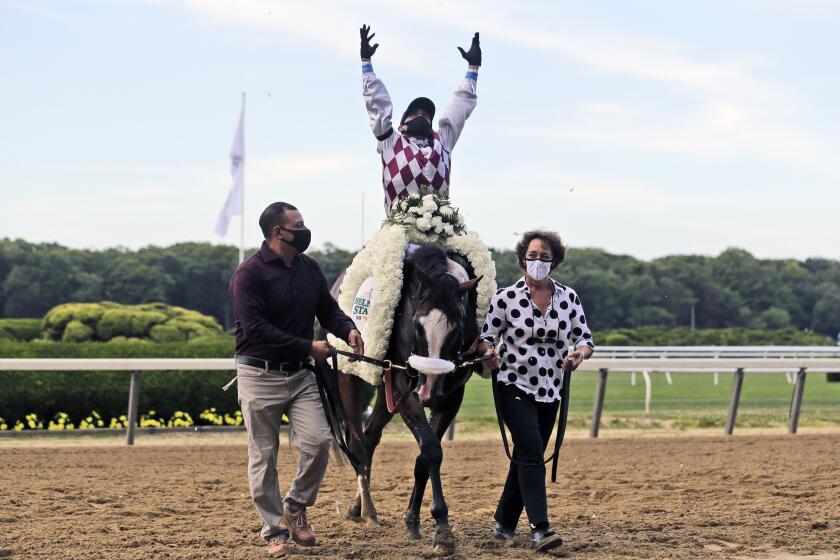 Jockey Manny Franco reacts after winning the 152nd running of the Belmont Stakes horse race with Tiz the Law, Saturday, June 20, 2020, in Elmont, N.Y. (AP Photo/Seth Wenig)