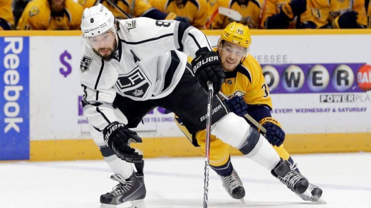 Kings defenseman Drew Doughty is followed by Predators left wing Viktor Arvidsson during the first period of a game on Dec. 22.