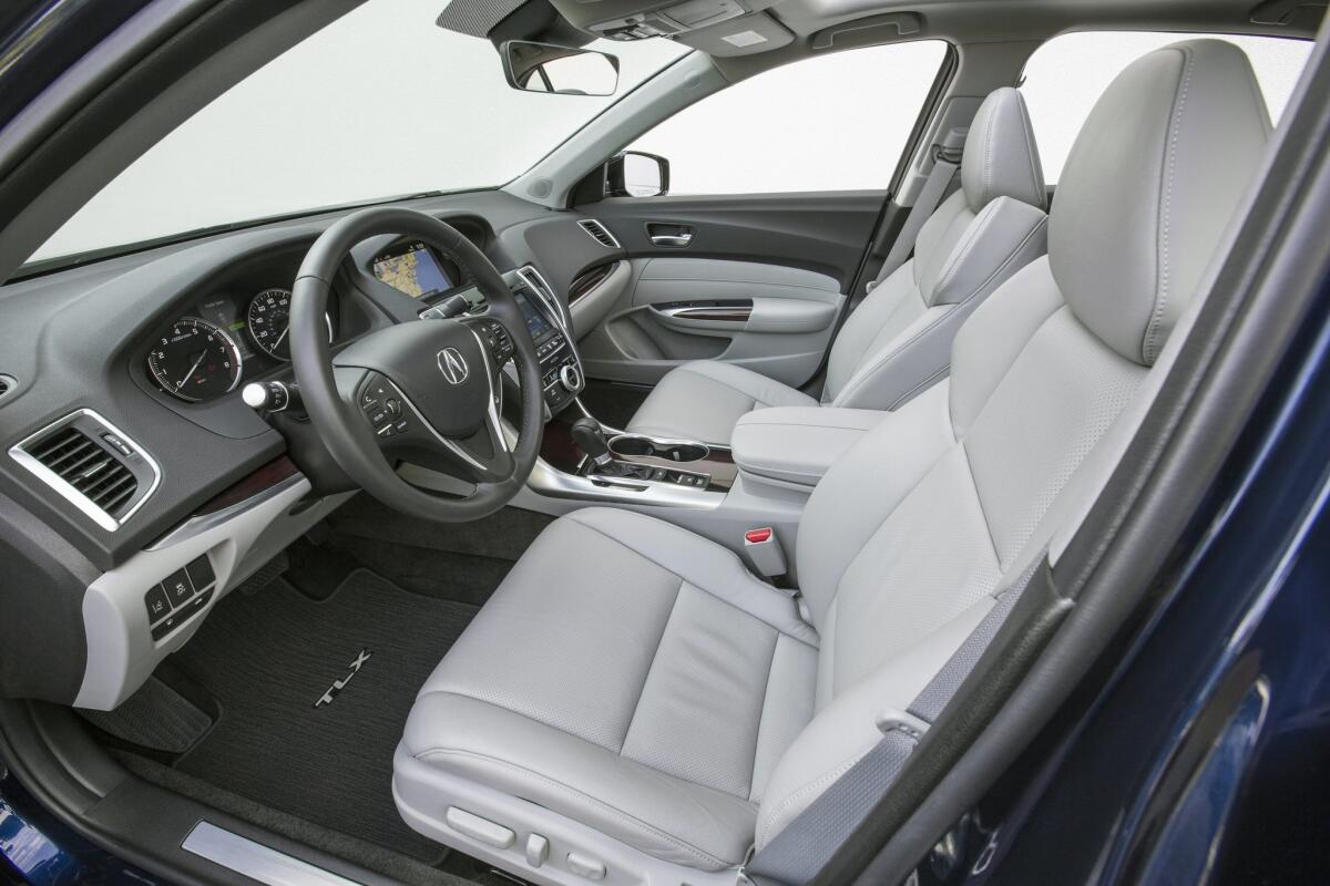 The interior is well appointed with an abundance of conveniences and varied textures, satin metal trim and well-padded places for elbows. But the design is tepid and the faux wood trim is out of place in what should be a sport-sedan environment.