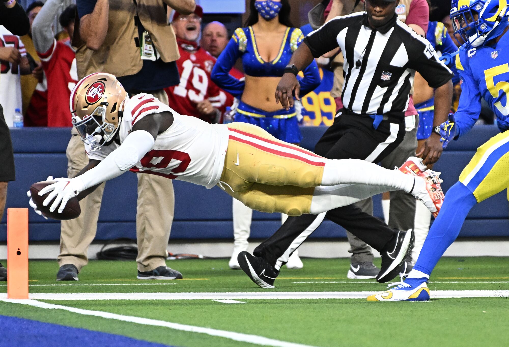 San Francisco 49ers wide receiver Deebo Samuel dives for the end zone to beat Rams cornerback Jalen Ramsey.