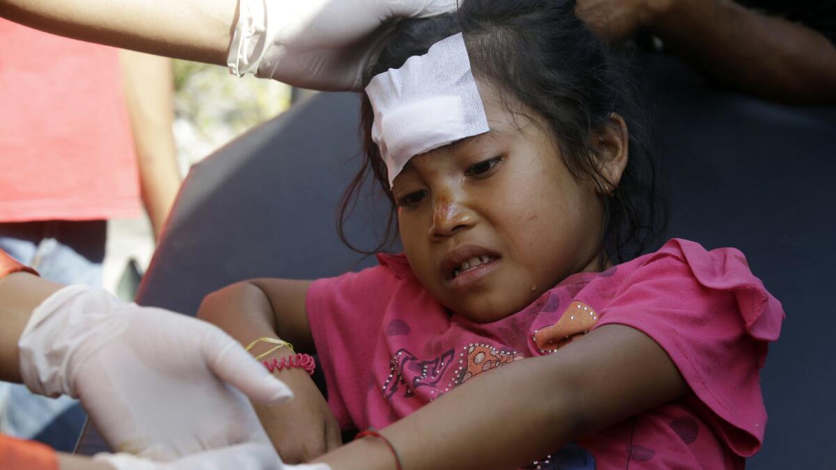 A girl injured in an earthquake is treated in Mataram, Lombok, Indonesia, on Thursday.