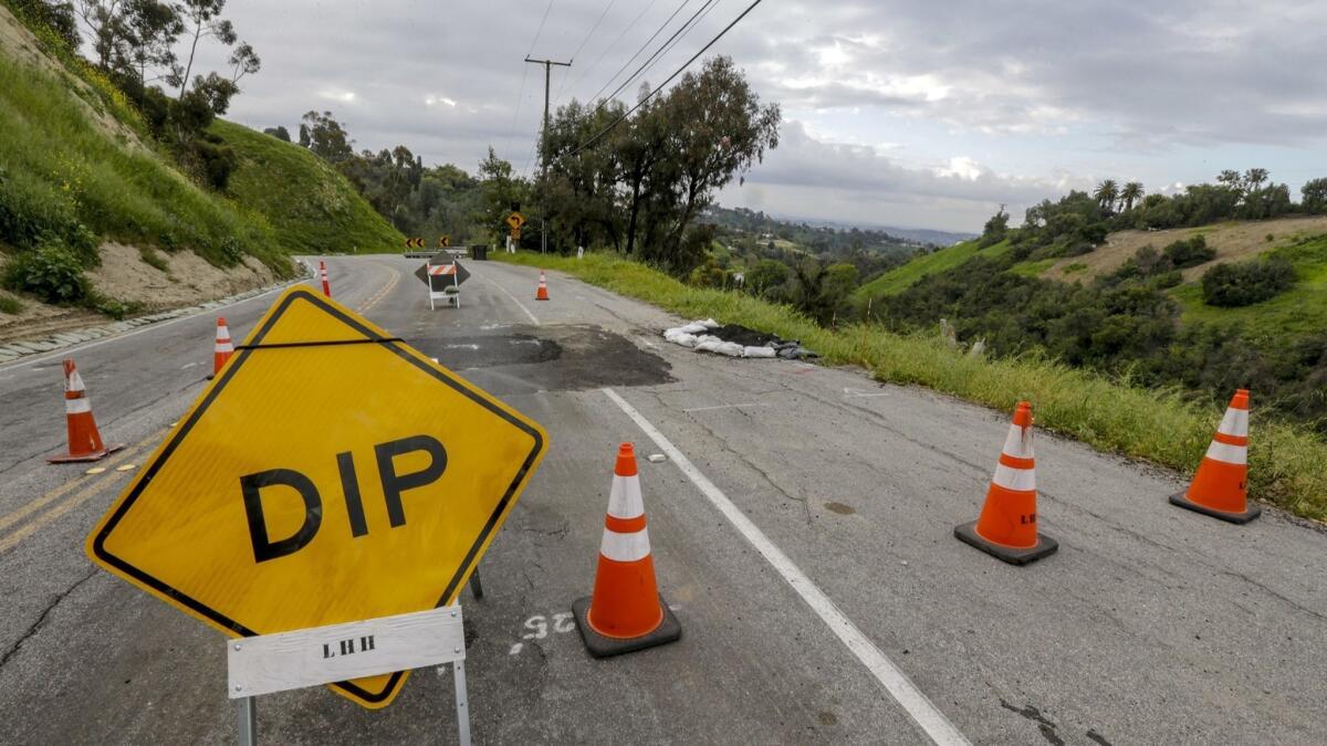 A section of Hacienda Road in La Habra Heights between Skyline Drive and Canada Sombre Road has been closed after the pavement sank several inches.