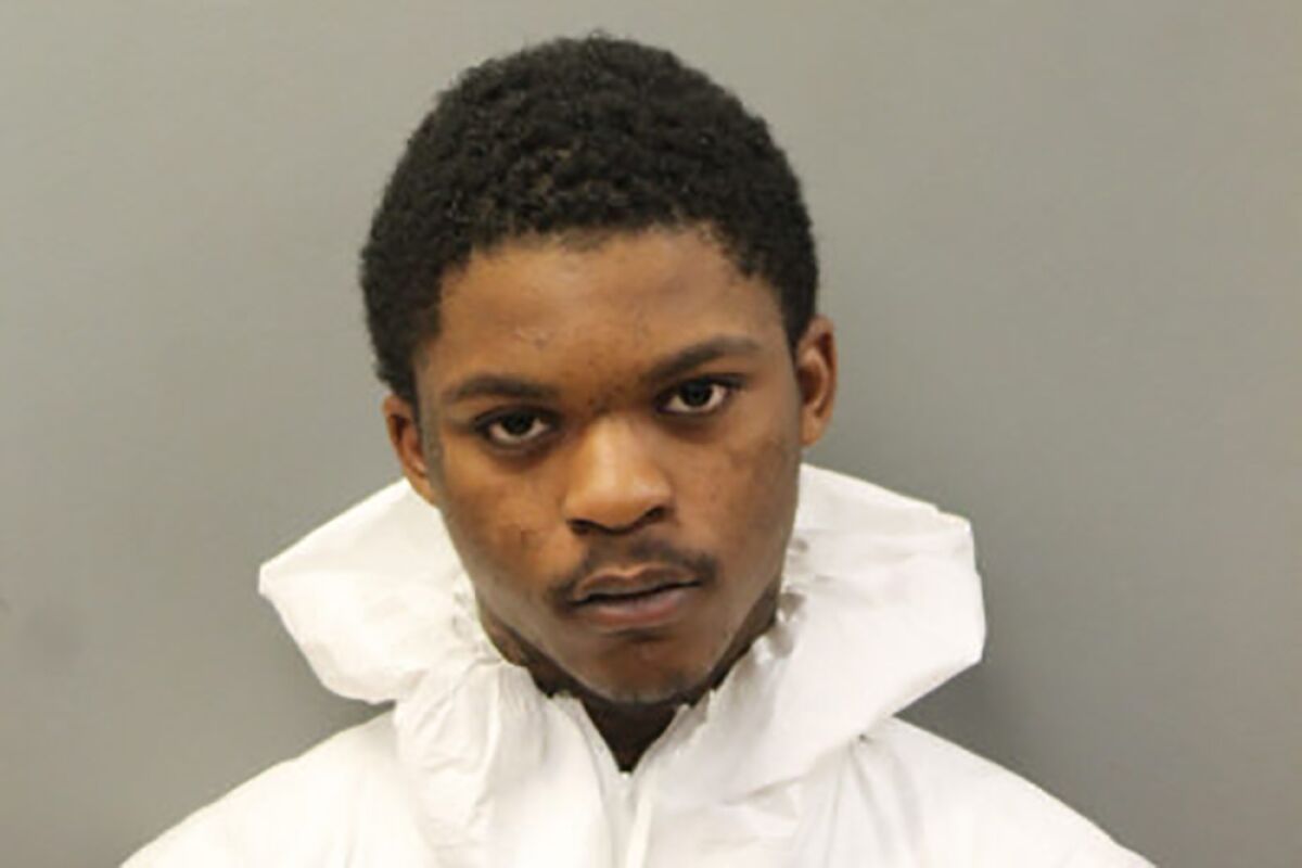 This booking image released by the Chicago Police Department shows Tarrion Johnson, 19, who was arrested, Thursday, June 2, 2022, shortly after he allegedly shot an officer with the U.S. Marshals Service’s fugitive apprehension team and his federal police dog as the officer was serving an arrest warrant on Chicago’s Northwest Side. (Chicago Police Department via AP)