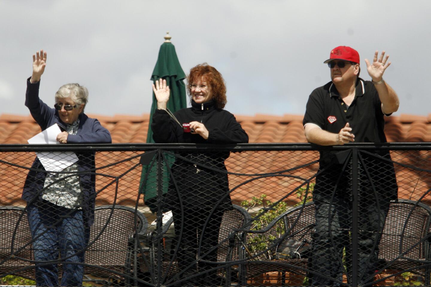 Fran Allen, from left, Gladys Pentland and Steve Alle wave to participants in Burbank on Parade, which took place on Olive Ave. between Keystone St. and Lomita St. on Saturday, April 14, 2012.