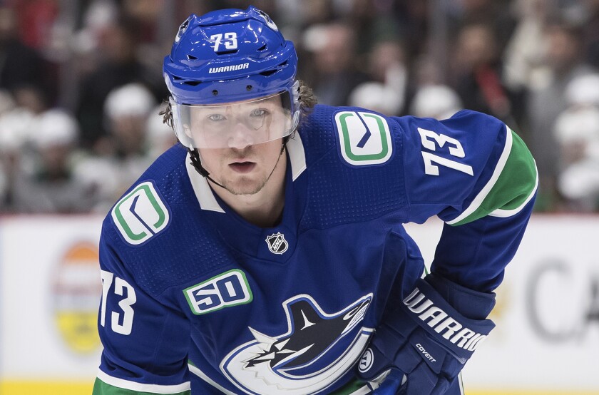 Tyler Toffoli, playing for the Vancouver Canucks, readies for a faceoff.