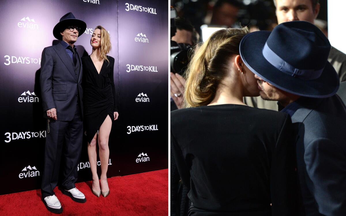 Reportedly engaged actors Johnny Depp and Amber Heard give a little PDA at the "3 Days to Kill" premiere in Hollywood on Wednesday.
