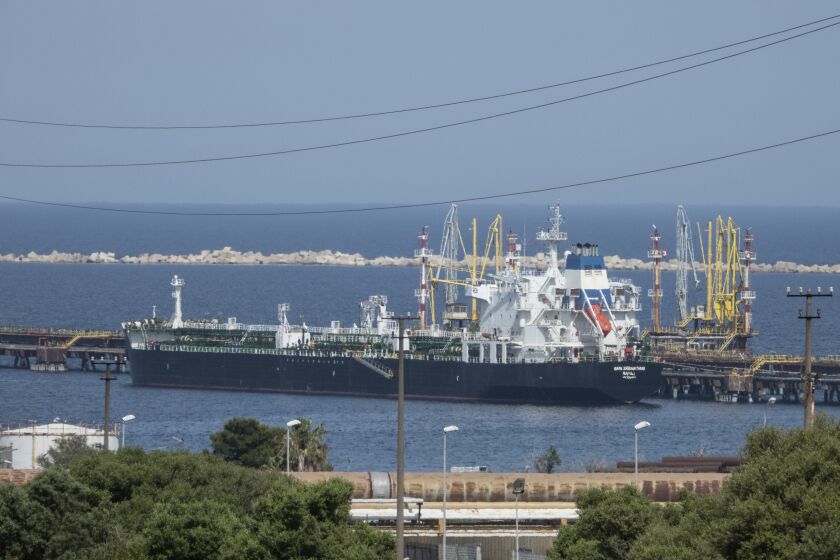 FILE - The San Sebastian oil tanker is moored at the docks of the ISAB refinery in Priolo-Gargallo near Syracuse, Sicily, May 31, 2022. The ISAB is owned by Russia's Lukoil. The U.S. and its allies are navigating questions as they plan to impose a price cap on Russian oil by December. (AP Photo/Gaetano Adriano Pulvirenti, File)