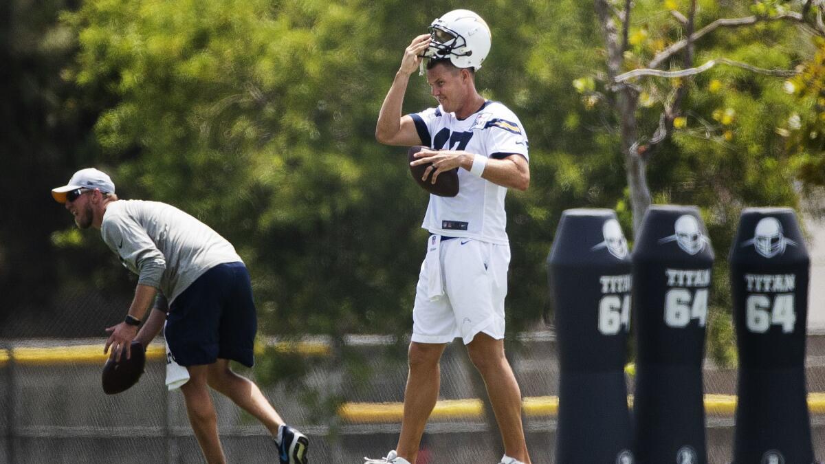 Chargers quarterback Phillip Rivers (17) takes extra throws at the end of training camp.