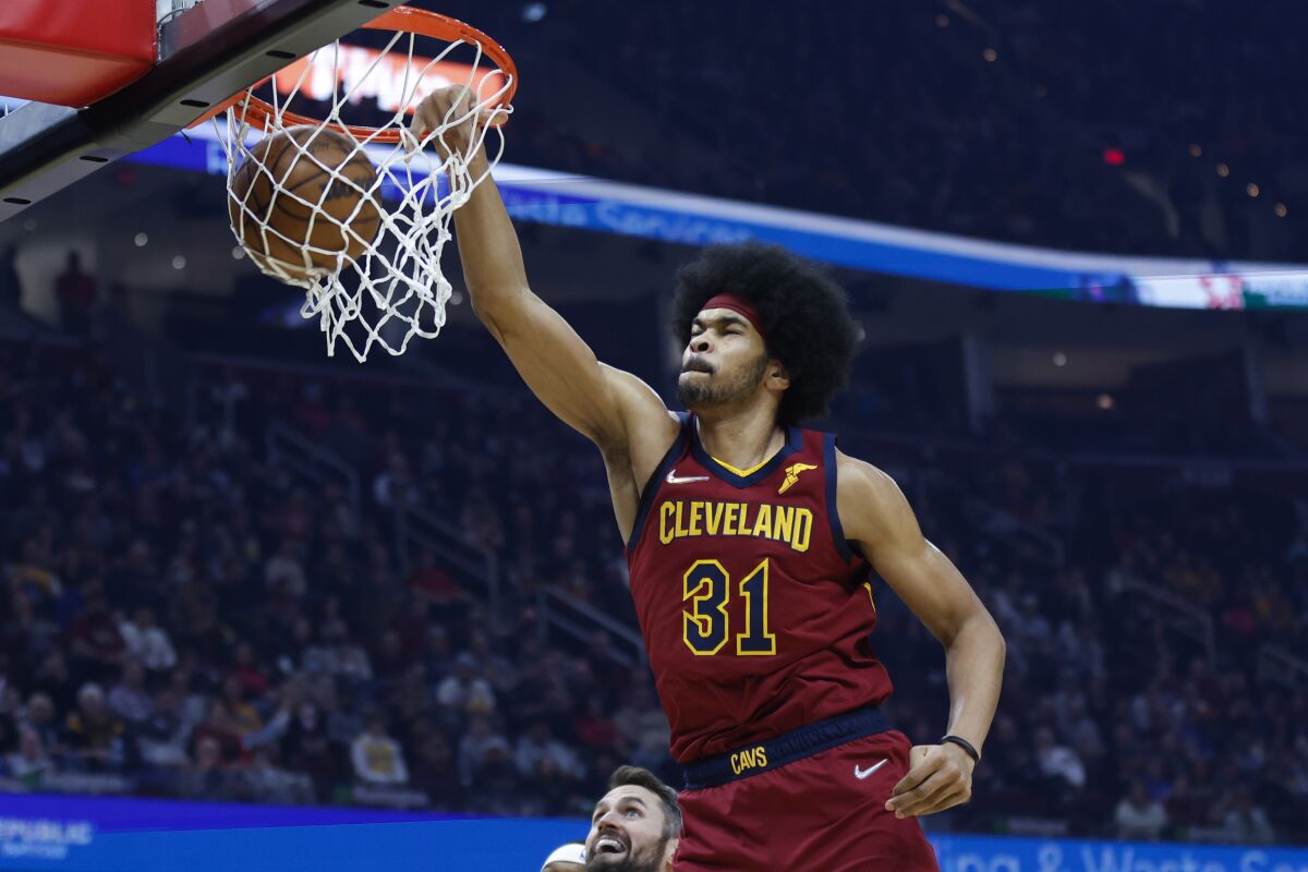 Cleveland Cavaliers' Jarrett Allen (31) dunks against the Indiana Pacers during the first half of an NBA basketball game, Sunday, Feb 6, 2022, in Cleveland. (AP Photo/Ron Schwane)