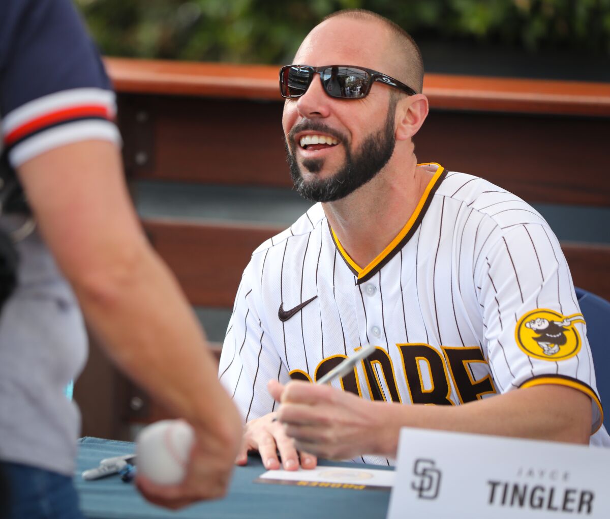 Padres manager Jayce Tingler signs autographs during the team's FanFest last month.