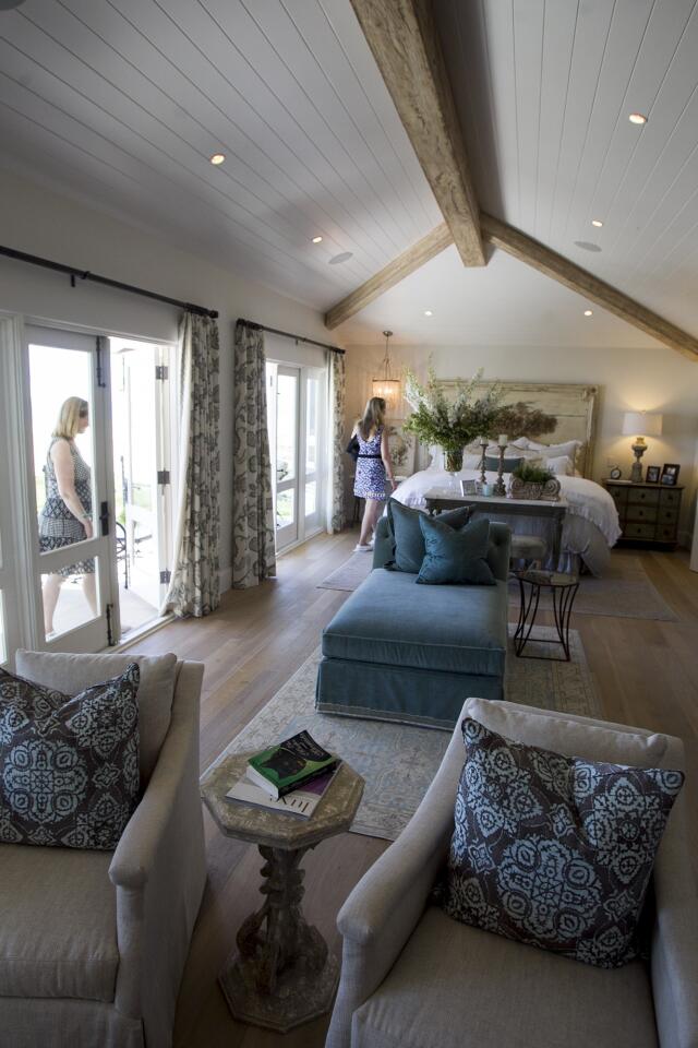 Guests take a look at the view from the master bedroom at the Buntmann Residence at 2054 East Oceanfront during the Newport Harbor Home tour on Thursday, May 15. (Scott Smeltzer - Daily Pilot)