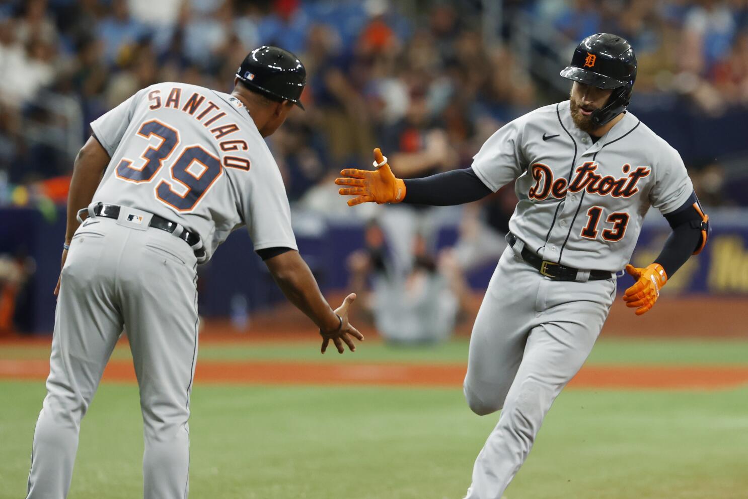 Tampa Bay Rays' Nelson Cruz is congratulated by third base coach