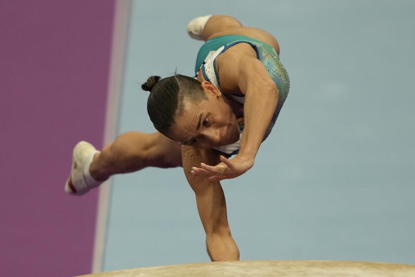 48 years old Uzbekistan's Oksana Chusovitina competes in the Artistic Gymnastics Women's Vault event of the 19th Asian Games in Hangzhou, China, Thursday, Sept. 28, 2023. Oksana Chusovitina competed in her first Olympics in 1992 in Barcelona. Now 48, and she's not done yet despite the fact her competition is generations younger. Few were even born when she won Olympic gold. She finished fourth in the vault this week at the Asian Games and says she's aiming for next year's Olympics in Paris, when she would be 49.(AP Photo/Ng Han Guan)